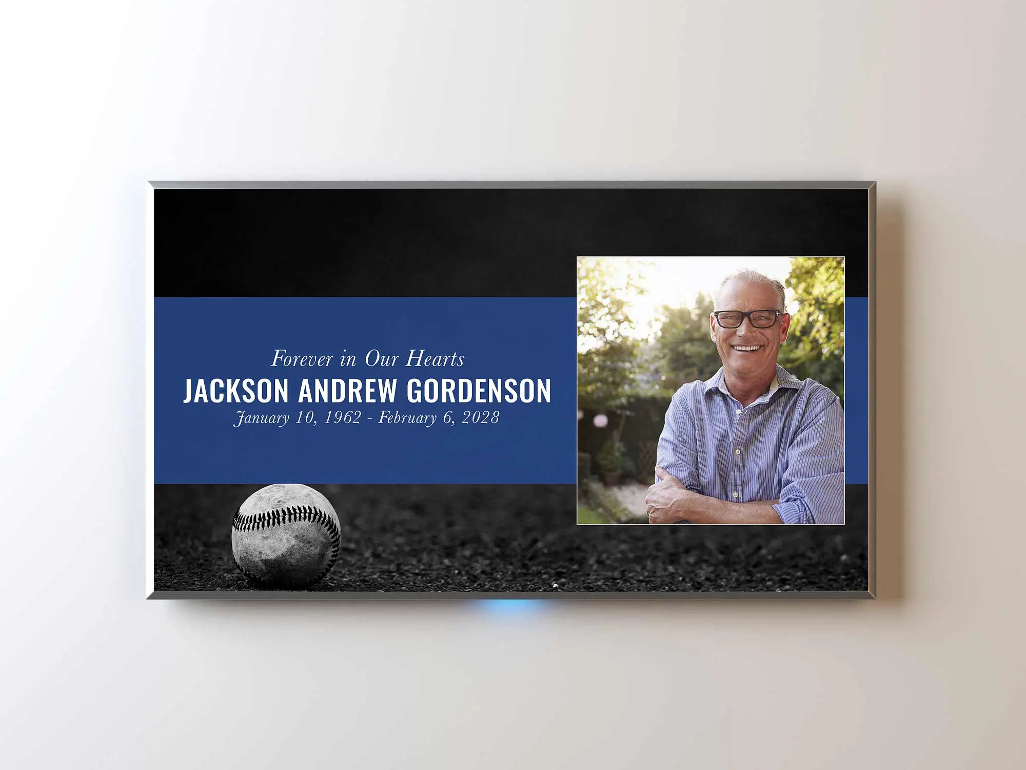 Baseball on the ground in black and white with blue accent.