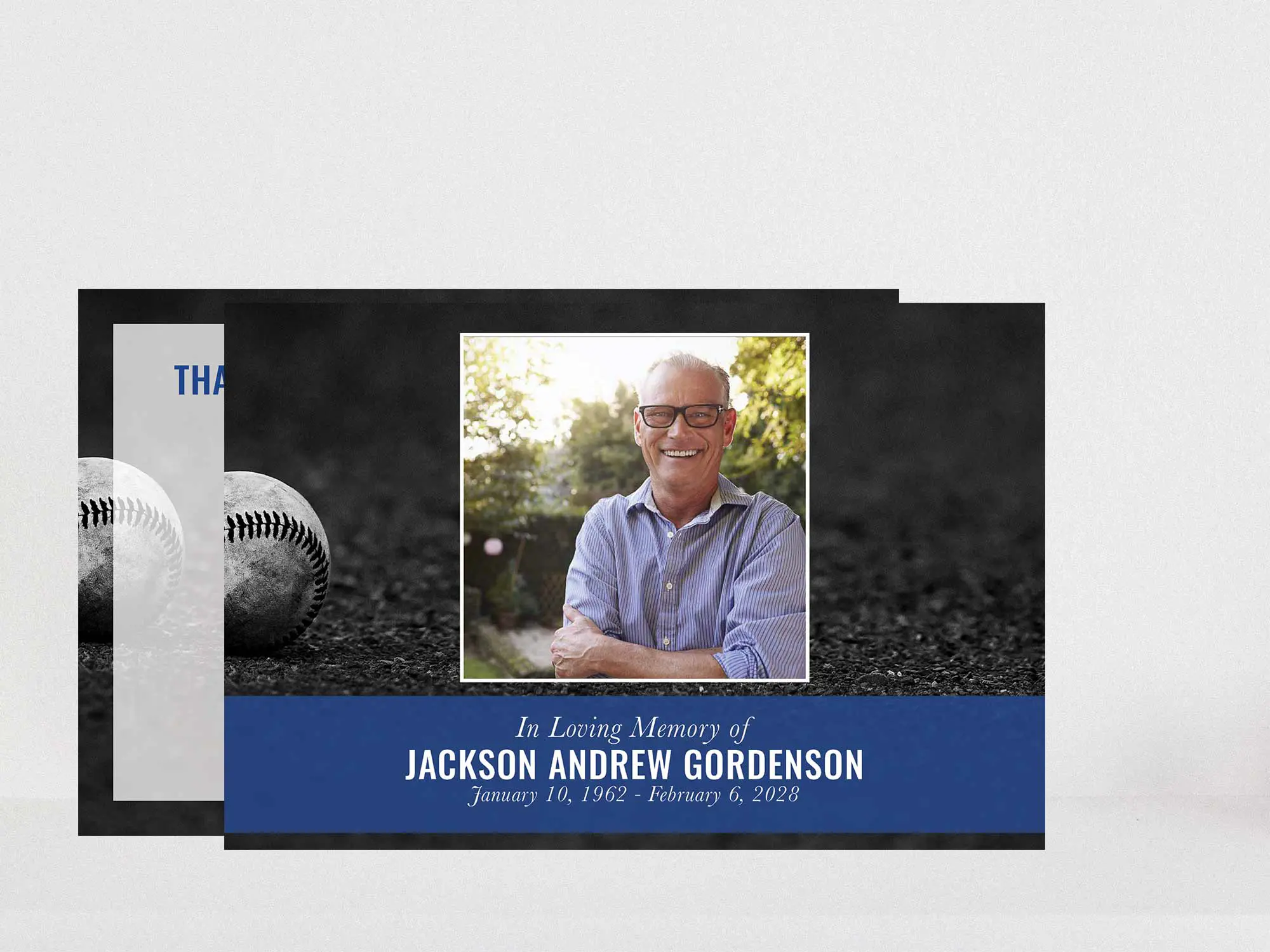 Baseball on the ground in black and white with blue accent.